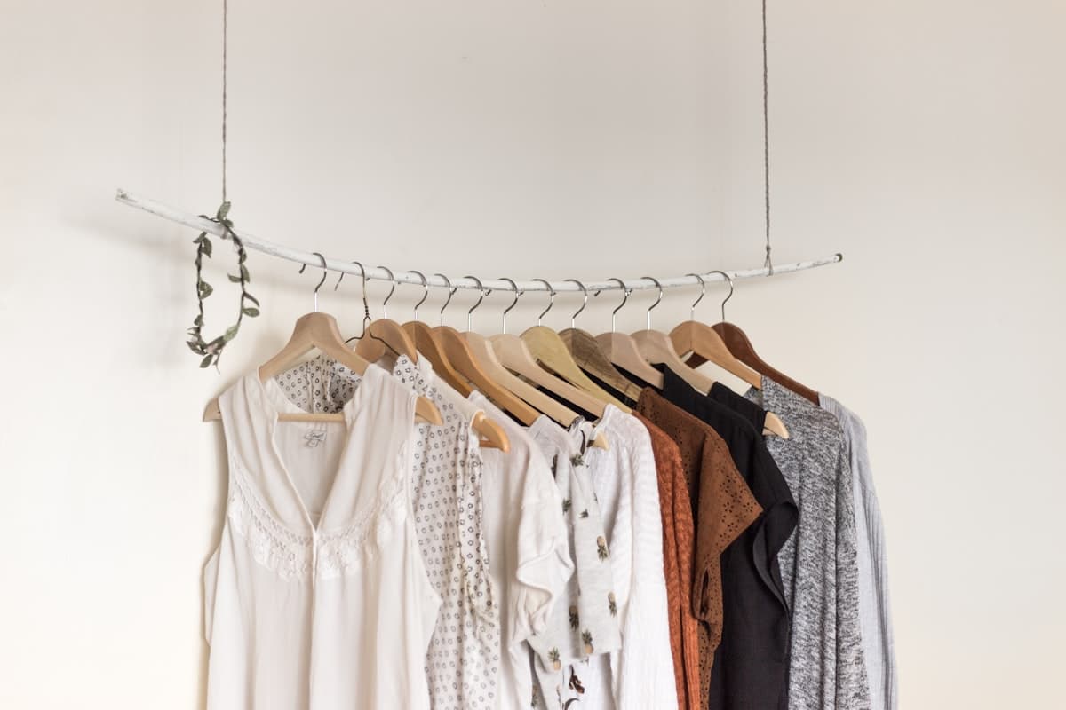 Simple beige knitwear with minimal accessories — the Quiet Luxury aesthetic