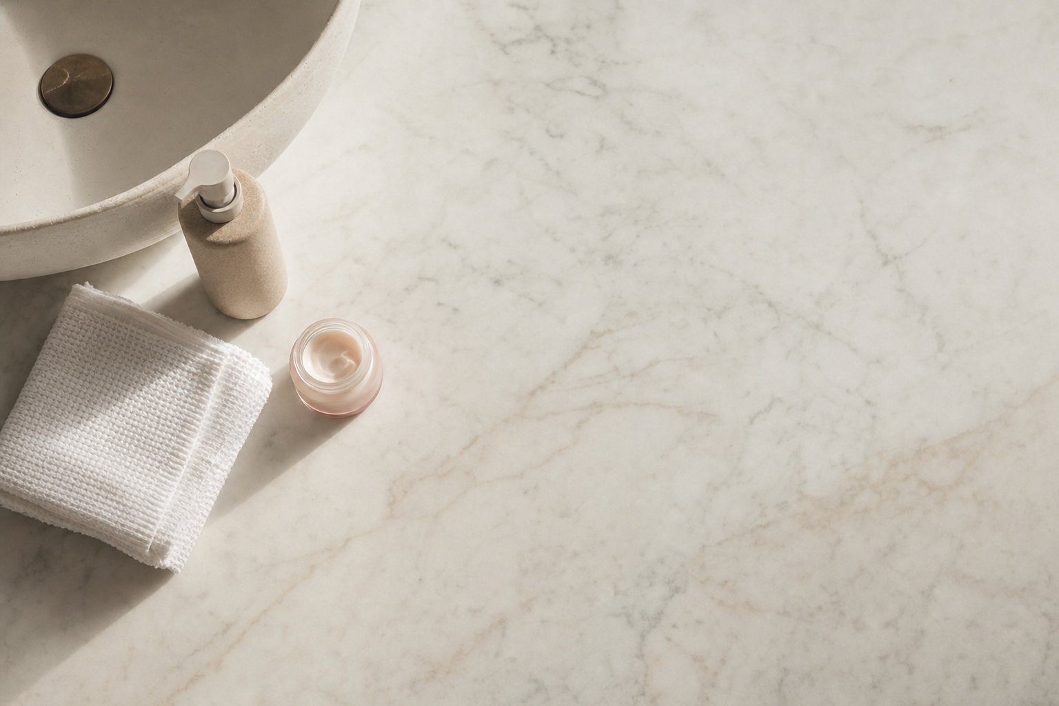 Minimal skincare items on a bathroom shelf